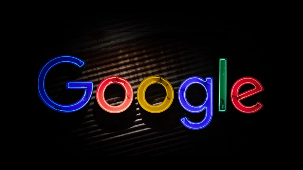 Neon Google logo on industrial wall
